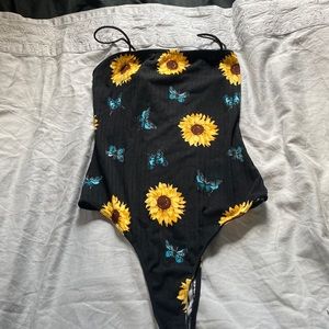 2 body suits the sunflower one never worn and the yellow dye die is fairly new